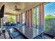Spacious, screened-in patio with dining and seating areas, perfect for outdoor enjoyment at 7502 Sea Lilly Ct, Apollo Beach, FL 33572