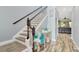 Elegant staircase with wood railings and decorative accents, leading to the upper level at 7502 Sea Lilly Ct, Apollo Beach, FL 33572