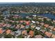 Waterfront home with lush landscaping and a private pool nestled in a serene neighborhood with lake views at 865 Live Oak Ne Ter, St Petersburg, FL 33703