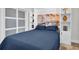 Bedroom featuring built-in shelving, storage and a murphy bed for space-saving convenience in this bedroom at 865 Live Oak Ne Ter, St Petersburg, FL 33703