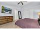 Relaxing bedroom boasts a ceiling fan, dresser, and closet for ample storage at 865 Live Oak Ne Ter, St Petersburg, FL 33703