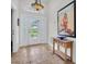 Inviting entryway with tiled floors, a decorative light fixture, and eye-catching wall art at 865 Live Oak Ne Ter, St Petersburg, FL 33703