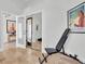 Bright workout space with mirrored wall and weight bench, ready for fitness activities and equipment at 865 Live Oak Ne Ter, St Petersburg, FL 33703