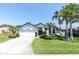 Well-maintained home with a lush front lawn, mature landscaping, and an attached two-car garage at 865 Live Oak Ne Ter, St Petersburg, FL 33703