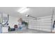 Spacious garage with ample storage, offering organized solutions for vehicles, tools, and household items at 865 Live Oak Ne Ter, St Petersburg, FL 33703