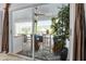 Patio view from bedroom with ceiling fan, furniture, and decorative plants at 865 Live Oak Ne Ter, St Petersburg, FL 33703
