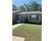 Charming single-story brick home with well-maintained lawn and classic architectural details at 9501 Lake Park Dr # 9501, Thonotosassa, FL 33592