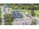 A fantastic aerial shot showcases the community clubhouse, pool, and tennis courts, a great place to relax and socialize at 9823 Rolling Cir, San Antonio, FL 33576