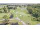 A magnificent aerial shot showcasing the meticulously maintained golf course and scenic waterways, a golfer's paradise at 9823 Rolling Cir, San Antonio, FL 33576