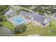 Aerial view of Tampa Bay Golf & Country Club clubhouse, showing the swimming pool and surrounding landscaping at 9823 Rolling Cir, San Antonio, FL 33576