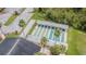 A picturesque aerial view showcasing the community shuffleboard courts, surrounded by lush greenery and providing endless entertainment at 9823 Rolling Cir, San Antonio, FL 33576
