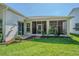 A lovely view of the well-maintained backyard and screened-in porch, perfect for outdoor relaxation at 9823 Rolling Cir, San Antonio, FL 33576