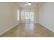 Bright bedroom featuring neutral walls, tile flooring and sliding glass doors to outdoor patio at 9823 Rolling Cir, San Antonio, FL 33576