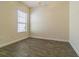 Bedroom with hard surface floors and a window providing natural light at 9823 Rolling Cir, San Antonio, FL 33576