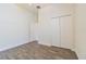 Bedroom with ample closet space, neutral paint, and hard surface floors at 9823 Rolling Cir, San Antonio, FL 33576