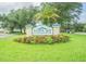Beautiful sign for Tampa Bay Golf and Country Club with manicured landscaping and a sunny sky at 9823 Rolling Cir, San Antonio, FL 33576