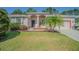Charming home with well-maintained lawn and inviting front entrance at 9823 Rolling Cir, San Antonio, FL 33576