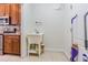 Convenient laundry room/mud room featuring stainless appliances, utility sink and ample storage space at 9823 Rolling Cir, San Antonio, FL 33576