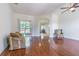Open living room boasts hardwood floors, lots of natural light and an open concept design at 9823 Rolling Cir, San Antonio, FL 33576