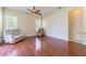 Living room showcasing beautiful wood floors and natural light at 9823 Rolling Cir, San Antonio, FL 33576