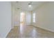 Spacious main bedroom boasts a ceiling fan, tile flooring and walk-in closet access to the ensuite bathroom at 9823 Rolling Cir, San Antonio, FL 33576