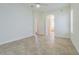 Large main bedroom featuring neutral walls, tile flooring, ceiling fan and natural light from the exterior window at 9823 Rolling Cir, San Antonio, FL 33576