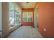 Screened patio featuring tiled floor, offering a comfortable outdoor space at 9823 Rolling Cir, San Antonio, FL 33576