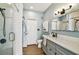 Updated bathroom featuring a glass shower, modern vanity, and stylish fixtures at 9828 Lake Chase Island Way # 0, Tampa, FL 33626