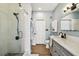 Updated bathroom featuring a glass shower, modern vanity, and stylish fixtures at 9828 Lake Chase Island Way # 0, Tampa, FL 33626