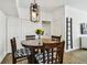 Cozy dining area featuring a classic round table with patterned chairs and modern lighting for Gathering meals at 9828 Lake Chase Island Way # 0, Tampa, FL 33626