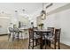 Inviting living space with a dining area, kitchen, and breakfast bar, ideal for modern living and entertaining guests at 9828 Lake Chase Island Way # 0, Tampa, FL 33626