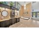 Luxurious bathroom with dual vanities, a soaking tub, and a chandelier at 1007 Morfield Ln, Brandon, FL 33511