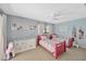 Bright, airy bedroom with two twin beds and a cozy, inviting atmosphere at 1007 Morfield Ln, Brandon, FL 33511
