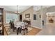 Elegant dining room with chandelier, decorative rug, and ample natural light at 1007 Morfield Ln, Brandon, FL 33511