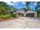 Beautiful home with a two-car garage and mature landscaping at 1007 Morfield Ln, Brandon, FL 33511