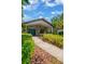 Inviting front entrance with double doors, stone accents, and mature landscaping at 1007 Morfield Ln, Brandon, FL 33511
