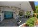 Charming front porch with seating, stone accents, and blue double doors at 1007 Morfield Ln, Brandon, FL 33511