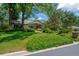 Charming home with stone accents, mature landscaping, and a well-manicured lawn at 1007 Morfield Ln, Brandon, FL 33511
