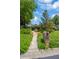 Charming home featuring a well-manicured front yard and inviting entrance with lush landscaping at 1007 Morfield Ln, Brandon, FL 33511