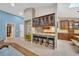 Spacious kitchen features dark wood cabinetry, granite counters, and breakfast bar seating at 1007 Morfield Ln, Brandon, FL 33511