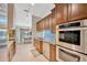 Modern kitchen featuring granite countertops, stainless steel appliances, and ample cabinet space at 1007 Morfield Ln, Brandon, FL 33511
