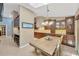Open kitchen and dining area with elegant chandelier and ample cabinet space at 1007 Morfield Ln, Brandon, FL 33511