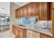 Modern kitchen featuring granite countertops, stainless steel appliances, and custom cabinetry at 1007 Morfield Ln, Brandon, FL 33511