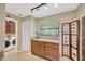 Well-organized laundry room with storage cabinets and countertop space at 1007 Morfield Ln, Brandon, FL 33511