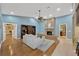 Inviting living room with a brick fireplace, hardwood floors, and abundant natural light at 1007 Morfield Ln, Brandon, FL 33511