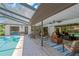 Covered patio with a view of the pool and outdoor seating at 1007 Morfield Ln, Brandon, FL 33511