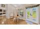 Bright playroom area with table, chairs, and natural light from an exterior glass door at 1007 Morfield Ln, Brandon, FL 33511