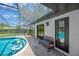 Sparkling pool with screened enclosure, poolside seating, and a lovely outdoor space at 1007 Morfield Ln, Brandon, FL 33511