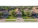 Beautiful single-Gathering home with lush landscaping, a brick driveway, and a two-car garage at 10450 Highland Park Pl, Palmetto, FL 34221
