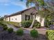 Beautifully landscaped yard with brick walkway showcasing lush green bushes around the house at 10450 Highland Park Pl, Palmetto, FL 34221
